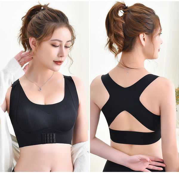 A woman models the PostureFix™ Bra For Women, a black 2-in-1 breast lifter and back support shaper with a scoop neckline, wide straps, front closure, and crisscross-back for posture correction. Her brown hair is in a ponytail.
